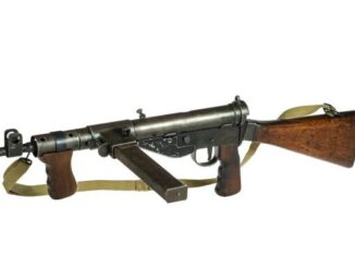 Vintage submachine gun with wooden stock.