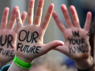 Hands with "Our Future" written on palms.