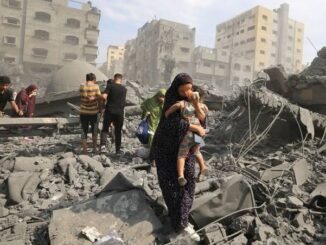 People amidst rubble in a destroyed city.