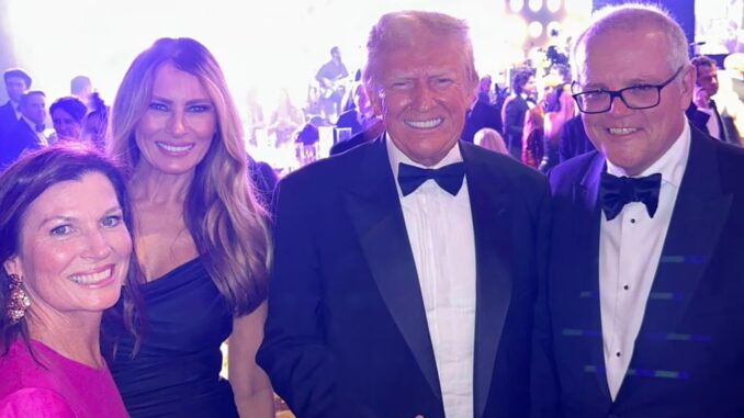 Four people smiling at formal event.
