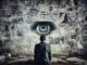 Man observing eye within newspaper collage.