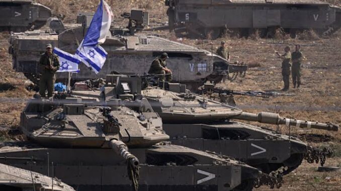 Military tanks with soldiers and Israeli flag.