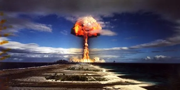 Nuclear explosion with mushroom cloud over island. Nuclear explosion with mushroom cloud over island.