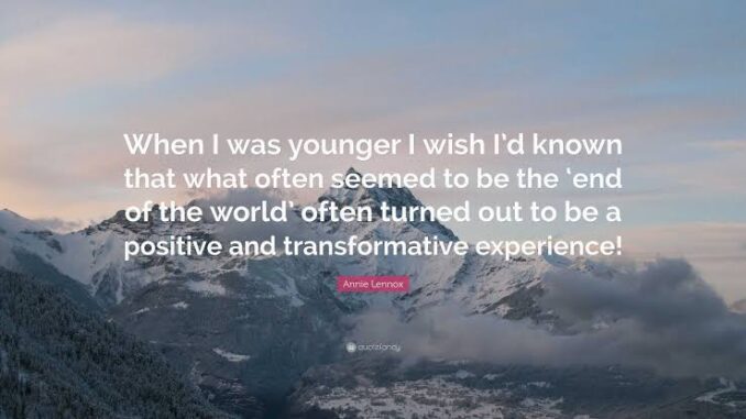 Inspirational quote over snowy mountain landscape.