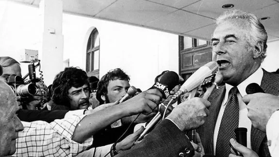 Politician speaking to reporters with microphones. Politician speaking to reporters with microphones.
