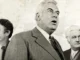 Three men in formal suits, vintage photograph.
