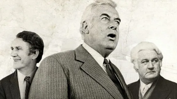 Three men in formal suits, vintage photograph.