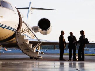 People meeting beside a private jet.