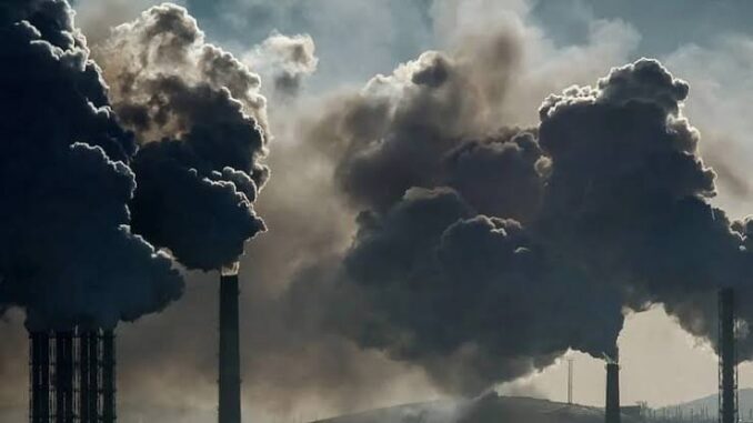 Factory chimneys emit dark smoke clouds. Factory chimneys emit dark smoke clouds.