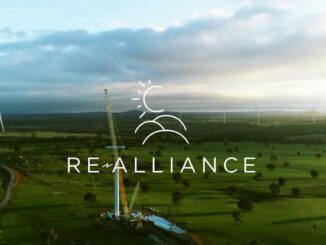 Wind farm landscape with RE-Alliance logo.