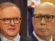 Two men in suits wearing glasses.