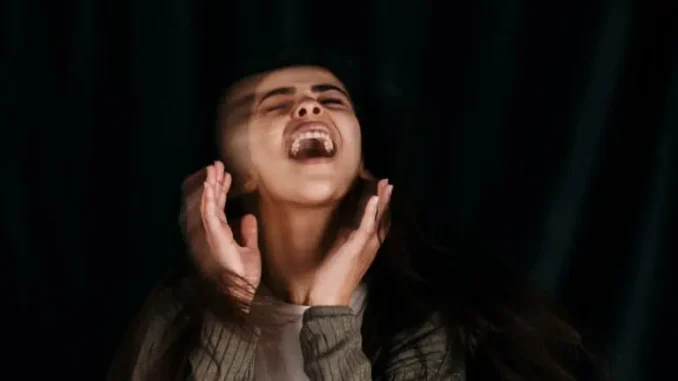 Person expressing intense emotion or excitement.