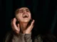 Person expressing intense emotion or excitement.