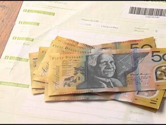 Australian dollars on top of a bill.