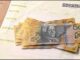 Australian dollars on top of a bill.