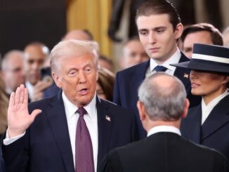 A man taking an oath in ceremony.
