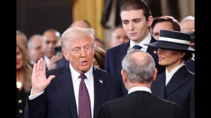 A man taking an oath in ceremony.