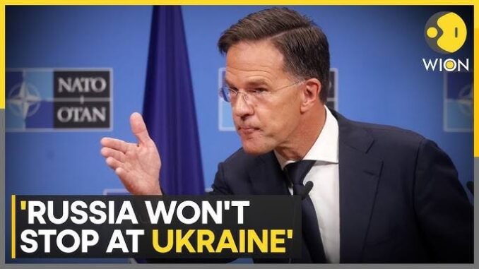 Man speaking at NATO press conference. Man speaking at NATO press conference.