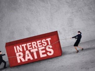 People pulling large "Interest Rates" block.
