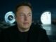 Man in black shirt with futuristic clocks.