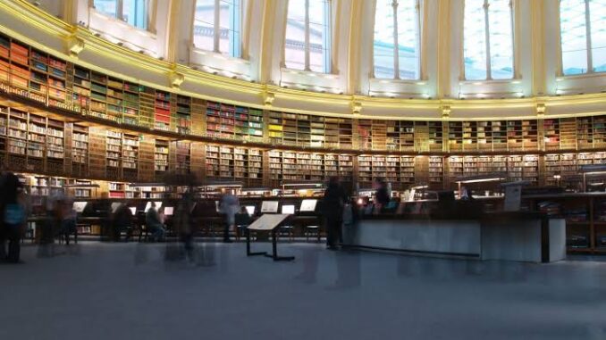 Historic library interior with arched ceiling.