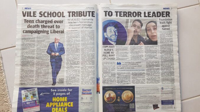 Open newspaper with articles and images displayed. Open newspaper with articles and images displayed.