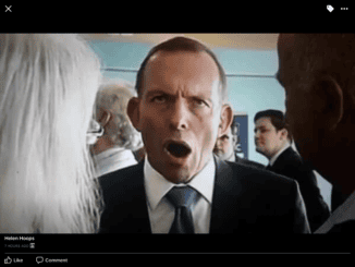 Man in suit speaking with expressive face.