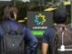 Two people outside Centrelink office entrance.