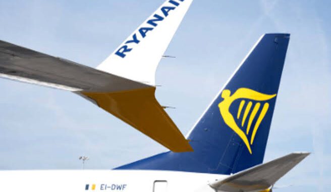 Ryanair airplane tail and logo in view. Ryanair airplane tail and logo in view.