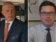 Two men in suits, one wearing glasses.