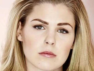 Portrait of a woman with blonde hair.