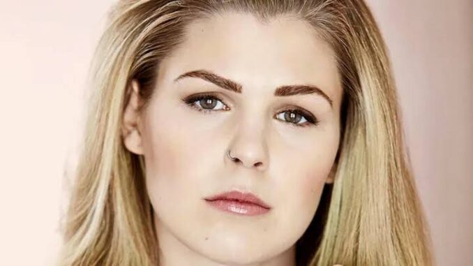 Portrait of a woman with blonde hair.
