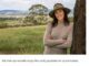Woman in a hat standing by tree.
