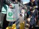 People collecting water with Oxfam containers.