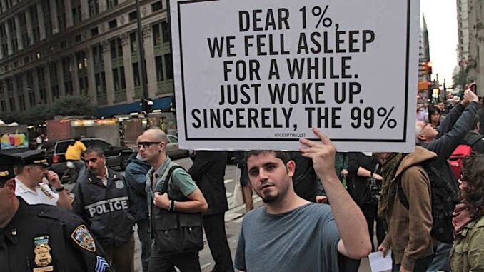 Protester holding sign in city street. Protester holding sign in city street.