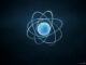 Atom model with orbiting electrons on dark background.