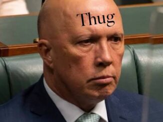 Bald man with "Thug" on forehead.