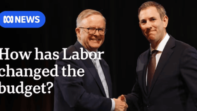 Two suited men shaking hands at event Two suited men shaking hands at event