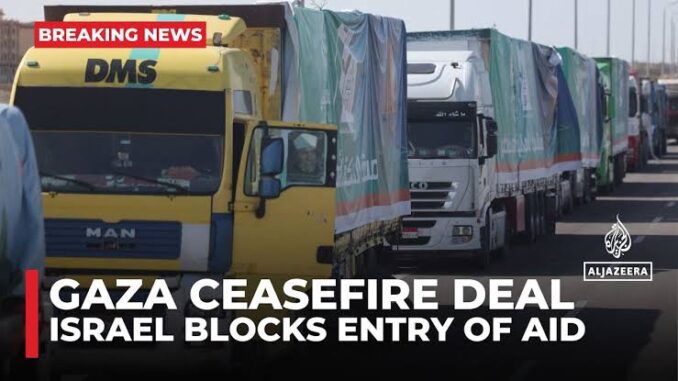 Trucks lined up, Gaza ceasefire news headline.