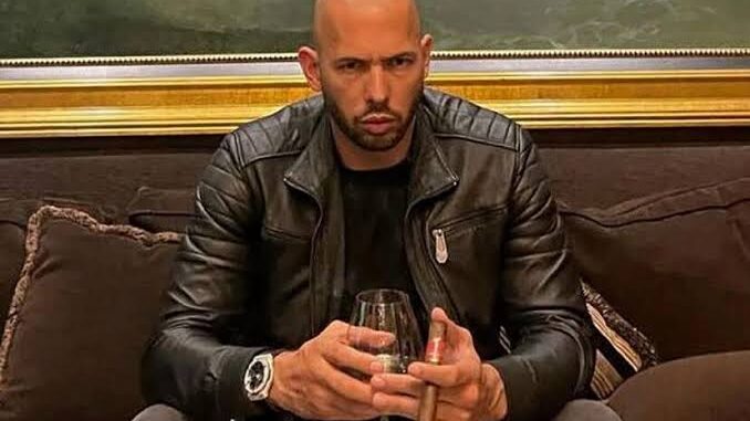 Man holding glass and cigar on couch. Man holding glass and cigar on couch.