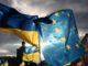 Ukrainian and EU flags waving together.