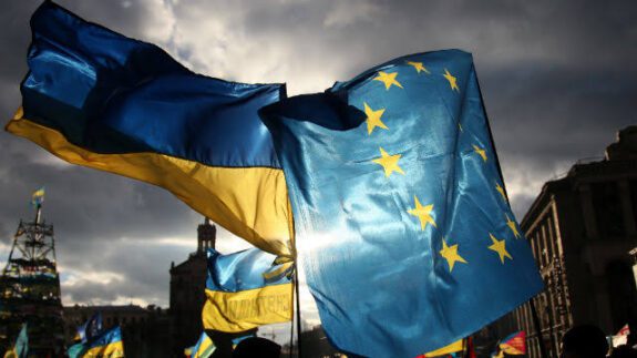 Ukrainian and EU flags waving together.