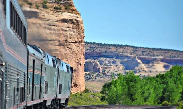 Train traveling through scenic desert landscape. Train traveling through scenic desert landscape.