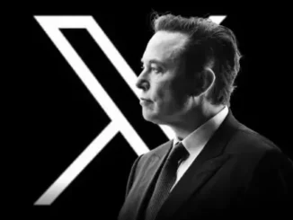 Man in suit with large letter X.