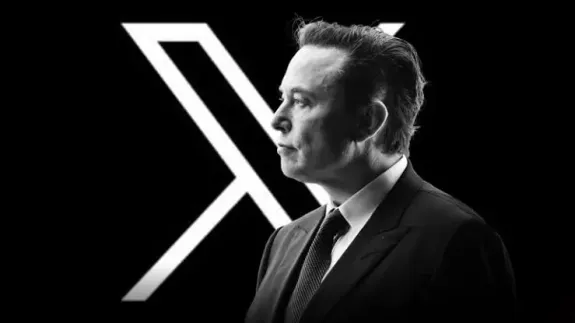 Man in suit with large letter X.