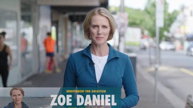 Person standing on a city street, speaking. Person standing on a city street, speaking.