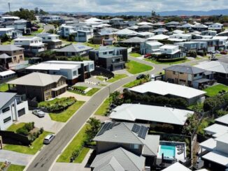 Suburban neighborhood with modern houses, aerial view.