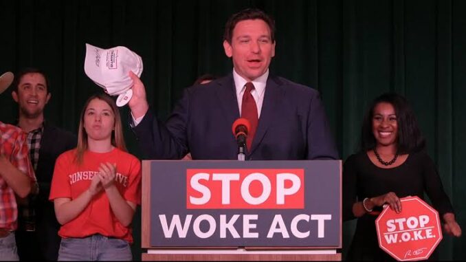 Man speaking at "Stop Woke Act" event.