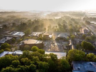 Aerial view of cityscape with morning fog.