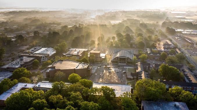 Aerial view of cityscape with morning fog.